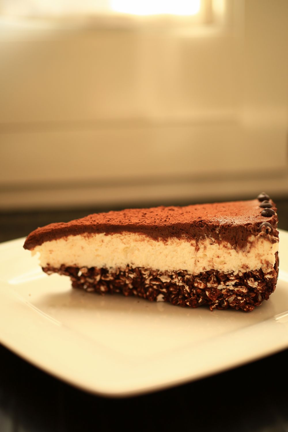 Cheesecake senza burro con fondo croccante al cioccolato e grano saraceno soffiato